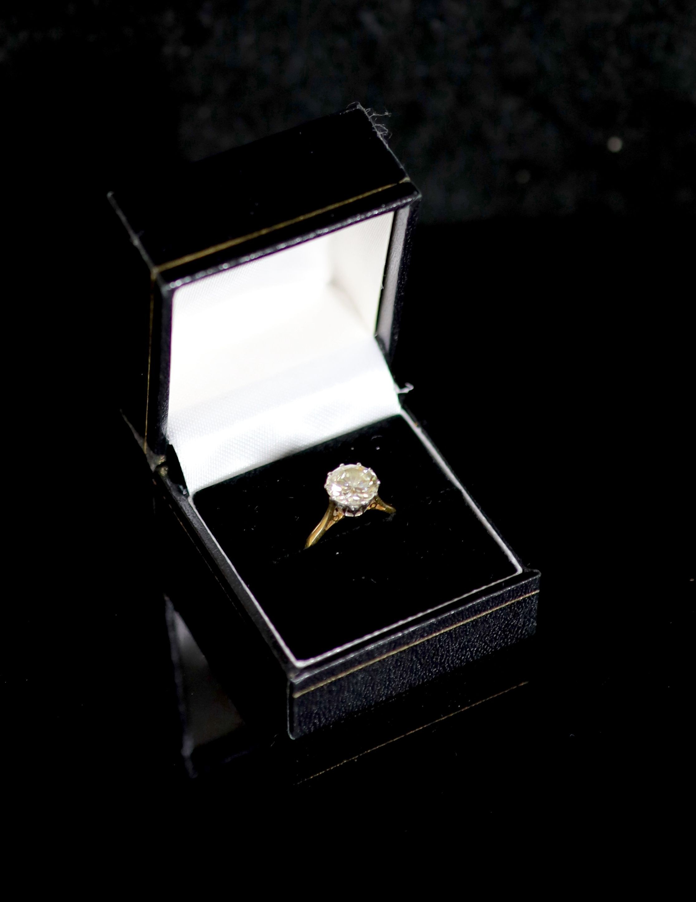 An 18ct gold and solitaire diamond ring